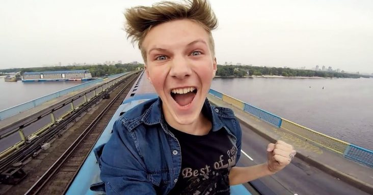 Ukranian vlogger Pasha Bumchik rides on top of a moving train